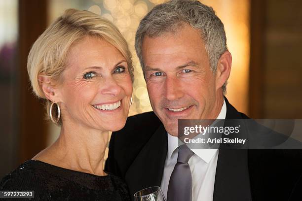 couple smiling in formal wear - formal party stock pictures, royalty-free photos & images