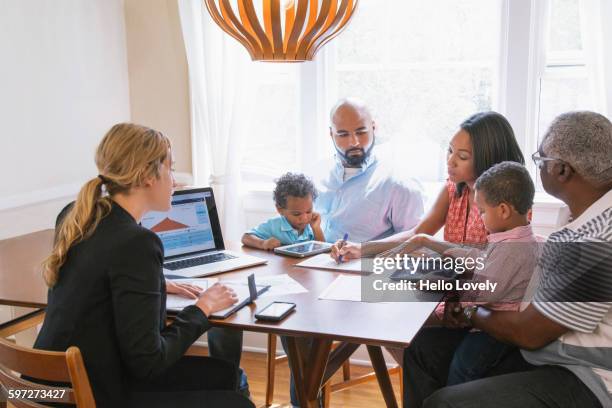 financial advisor talking to clients - family meeting stock pictures, royalty-free photos & images