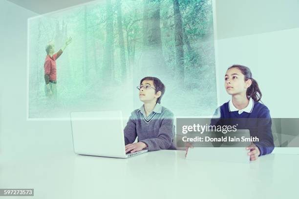 children watching floating screen in online class - new zealand schools stock pictures, royalty-free photos & images