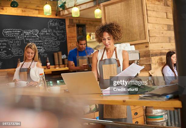 the latest bills at the coffee shop - bookie board stock pictures, royalty-free photos & images