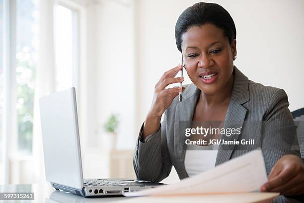 black businesswoman talking on cell phone - will call stock pictures, royalty-free photos & images