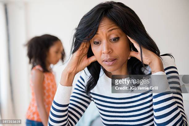 frustrated mother rubbing her temples - angry black woman stock pictures, royalty-free photos & images