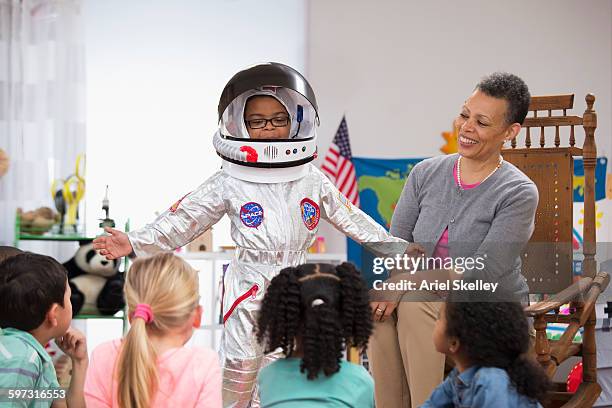 kindergarten student wearing astronaut costume - boy in briefs stock pictures, royalty-free photos & images