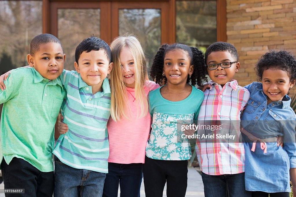Children smiling outdoors