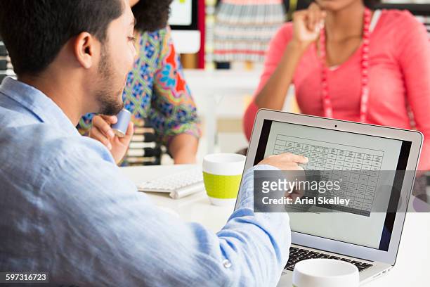 businessman using laptop in office meeting - bilan photos et images de collection