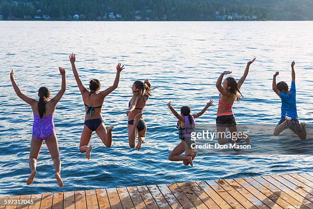 children jumping into lake - lake whatcom bildbanksfoton och bilder