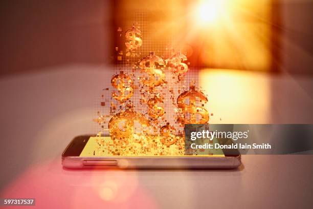 pixelated dollar signs floating over cell phone - digital currency photos et images de collection