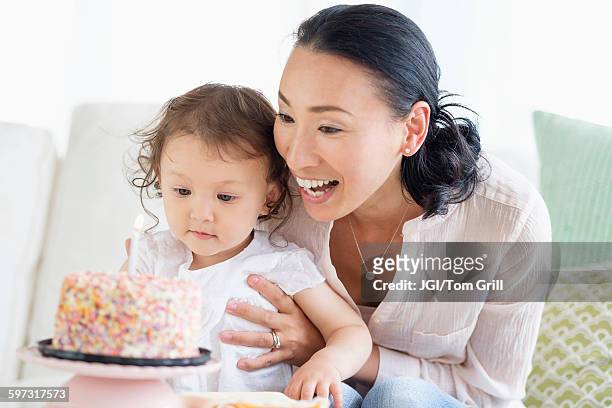 mother and baby daughter celebrating birthday - daughter birthday stock pictures, royalty-free photos & images