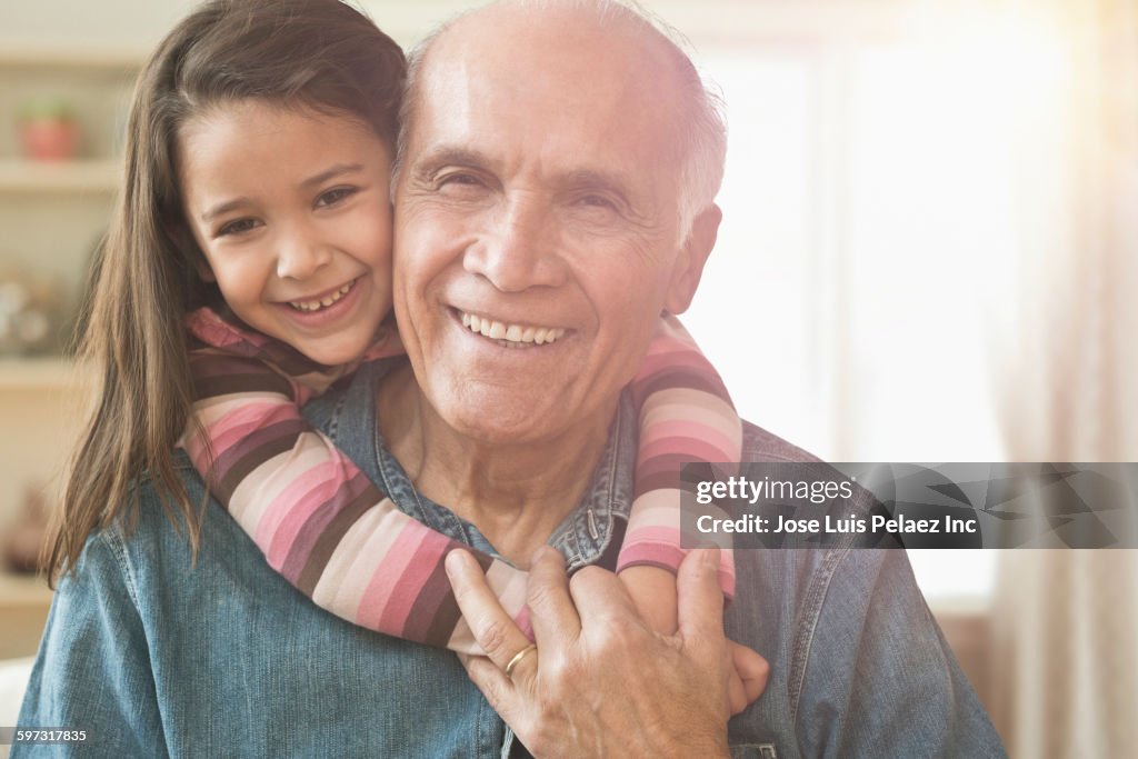 Granddaughter hugging grandfather