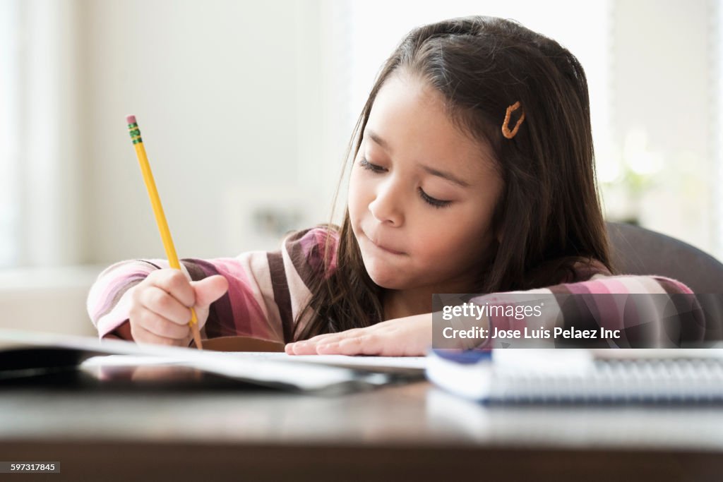 Mixed race girl doing homework