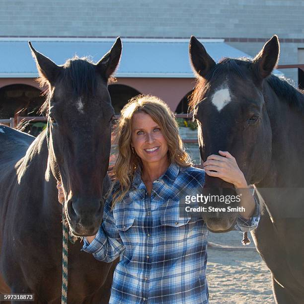 caucasian rancher smiling with horses - western dressage stock pictures, royalty-free photos & images