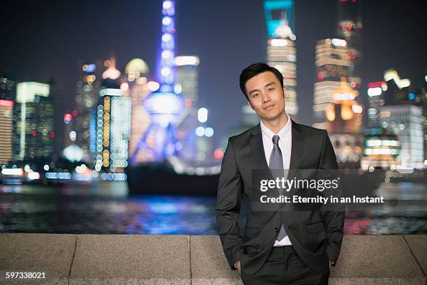 businessman in shanghai at night. - night suit stock pictures, royalty-free photos & images