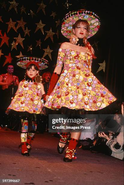 Mother & daughter" models on the runway at the Betsey Johnson Spring 1989 fashion show circa 1988 in New York City.