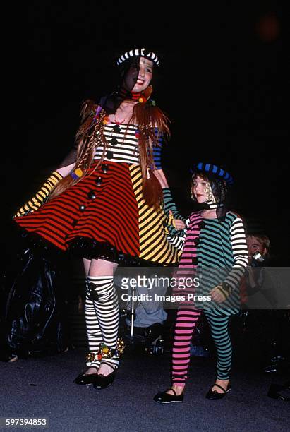 Mother & daughter" models on the runway at the Betsey Johnson Spring 1989 fashion show circa 1988 in New York City.