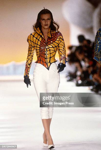 Model on the runway at the Thierry Mugler Spring 1989 fashion show circa 1988 in Paris, France.