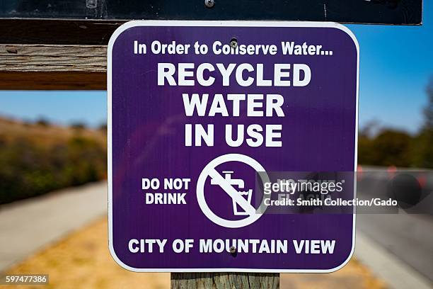 Sign in "Irvine Purple" color warning visitors that recycled water is in use and that they should not drink the water, in the Silicon Valley town of...