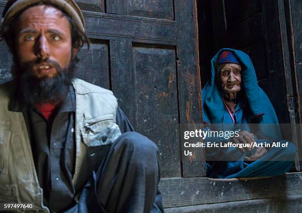 Afghan man with his old mother in a pamiri house, badakhshan province, qazi deh, Afghanistan on August 9, 2016 in Qazi Deh, Afghanistan.