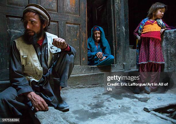 Afghan man with his old mother and his daughter in a pamiri house, badakhshan province, qazi deh, Afghanistan on August 9, 2016 in Qazi Deh,...