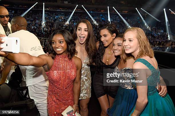 Olympic athletes Simone Biles, Aly Raisman, Laurie Hernandez and Madison Kocian pose with Kim Kardashian West at the 2016 MTV Video Music Awards at...
