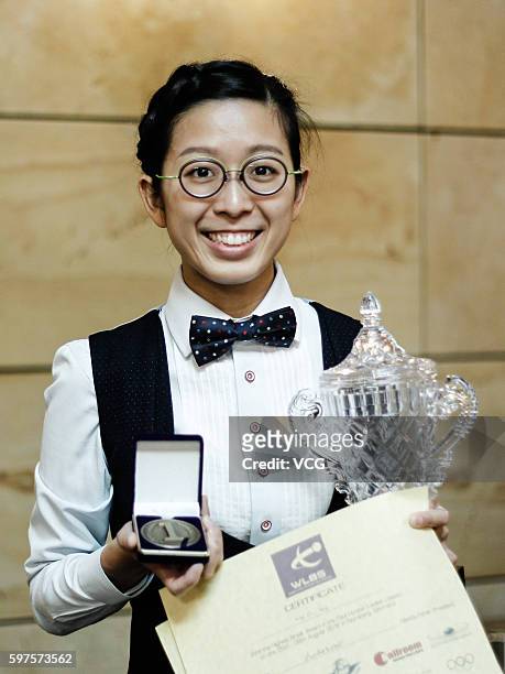 Ng On-Yee of Hong Kong celebrates with the trophy after winning the final match against Reanne Evans of England on day 4 of the Paul Hunter Ladies...