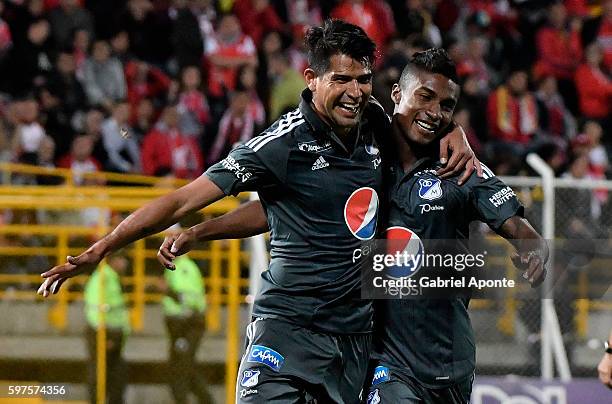 Enzo Gutierrez of Millonarios celebrates with Hector Quiñones after scoring the second goal of his team to Santa Fe during a match between...