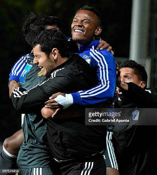 Enzo Gutierrez of Millonarios celebrates with teammates after scoring the second goal of his team during a match between Independiente Santa Fe and...