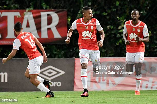William Tesillo of Santa Fe celebrates after scoring the first goal of his team during a match between Independiente Santa Fe and Millonarios as part...
