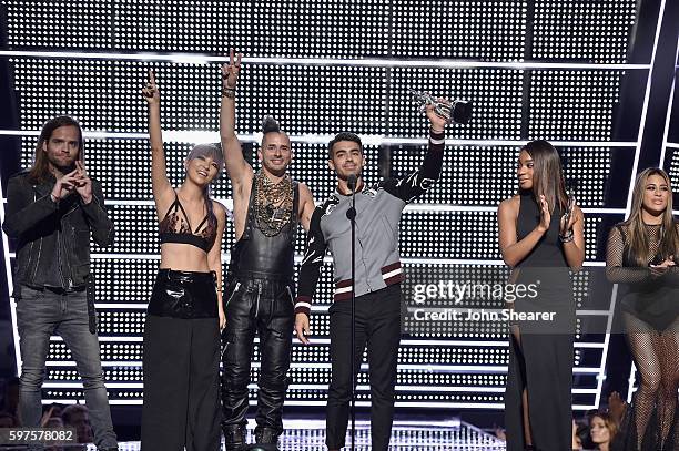 Jack Lawless, JinJoo Lee, Cole Whittle and Joe Jonas of DNCE accept an award onstage during the 2016 MTV Music Video Awards at Madison Square Gareden...