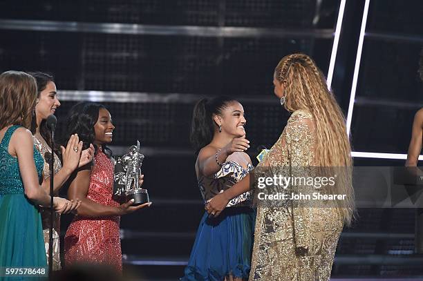 Madison Kocian, Aly Raisman, Simone Biles and Laurie Hernandez present an award to Beyonce onstage during the 2016 MTV Music Video Awards at Madison...