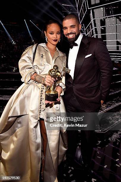 Singer Rihanna and rapper Drake pose onstage during the 2016 MTV Video Music Awards at Madison Square Garden on August 28, 2016 in New York City.