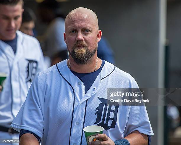 Casey McGehee of the Detroit Tigers walks around in the dugout in the third inning during a MLB game against the Boston Red Sox at Comerica Park on...