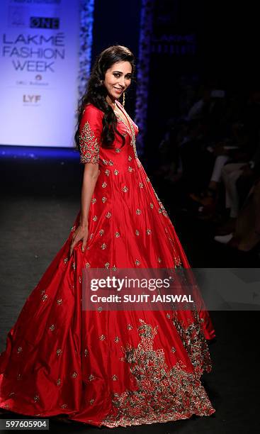 Indian Bollywood actress Karishma Kapoor showcases a creation by designer Architha Narayanam at Lakme Fashion Week Winter/Festive 2016 in Mumbai on...