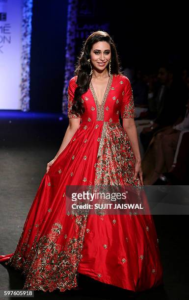 Indian Bollywood actress Karishma Kapoor showcases a creation by designer Architha Narayanam at Lakme Fashion Week Winter/Festive 2016 in Mumbai on...
