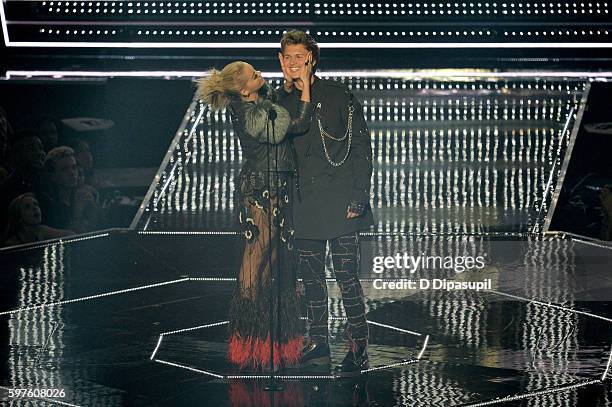 Rita Ora and Ansel Elgort speak onstage during the 2016 MTV Music Video Awards at Madison Square Garden on August 28, 2016 in New York City.