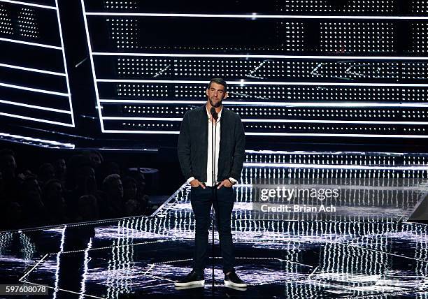 Michael Phelps speaks onstage during the 2016 MTV Video Music Awards at Madison Square Garden on August 28, 2016 in New York City.