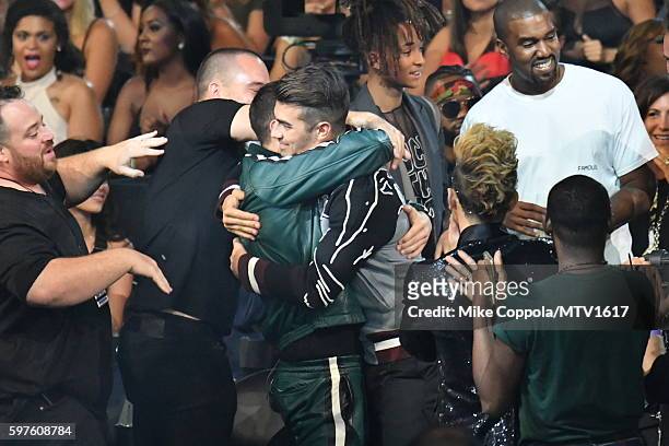 Nick Jonas, Joe Jonas, Jaden Smith and Kanye West mingle during the 2016 MTV Video Music Awards at Madison Square Garden on August 28, 2016 in New...