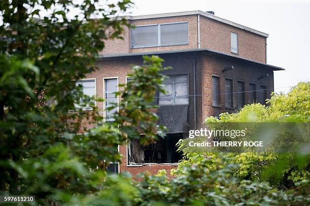 Picture shows a damaged window of the National Institute for Criminalistics and Criminology after an explosion overnight on August 29, 2016 in...