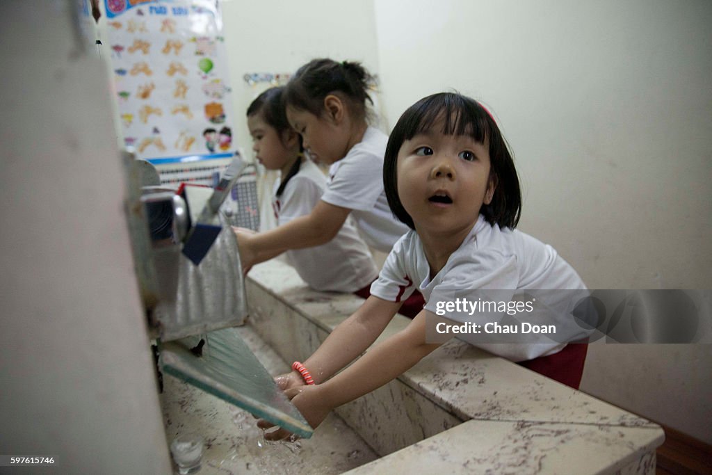 Students washing hand at Sakura Montessori international...