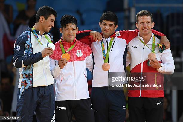 Silver medalist Rustam Orujov of Azerbaijan, gold medalist Shohei Ono of Japan, bronze medalists Lasha Shavdatuashvili of Georgia and Dirk van...