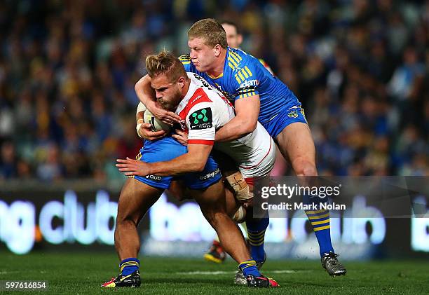 Jack De Belin of the Dragons is takcled during the round 25 NRL match between the Parramatta Eels and the St George Illawarra Dragons at Pirtek...