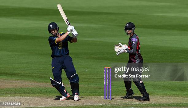 Warwickshire batsman Jonathan Trott hits out watched by wicketkeeper Ryan Davies during the Royal London One-Day Cup semi final between Warwickshire...