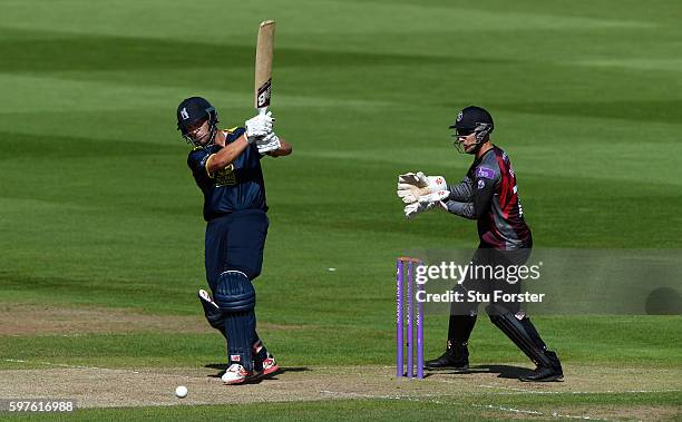 Warwickshire batsman Jonathan Trott hits out watched by wicketkeeper Ryan Davies during the Royal London One-Day Cup semi final between Warwickshire...