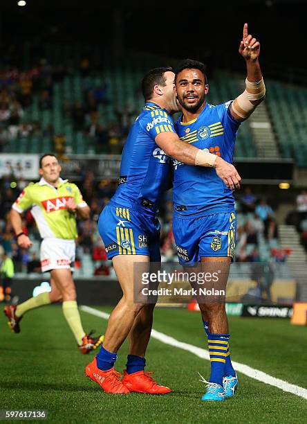 Bevan French of the Eels celebrates one of his tries during the round 25 NRL match between the Parramatta Eels and the St George Illawarra Dragons at...
