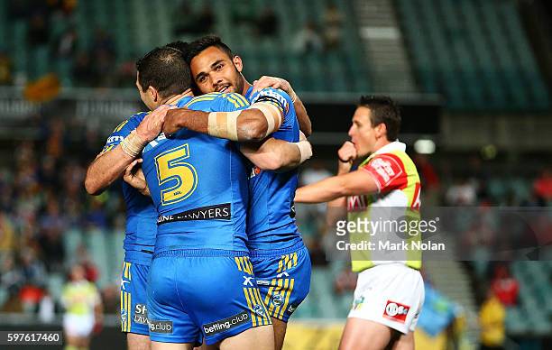 Bevan French of the Eels celebrates one of his tries with team mates during the round 25 NRL match between the Parramatta Eels and the St George...