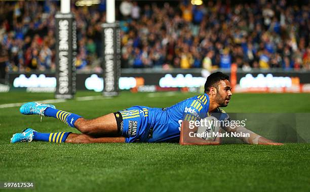 Bevan French of the Eels scores a try during the round 25 NRL match between the Parramatta Eels and the St George Illawarra Dragons at Pirtek Stadium...