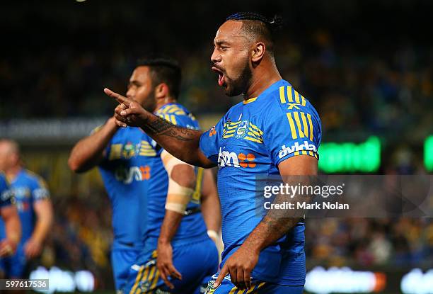 Kenneth Edwards of the Eels celebrates a try by team mate Bevan French during the round 25 NRL match between the Parramatta Eels and the St George...