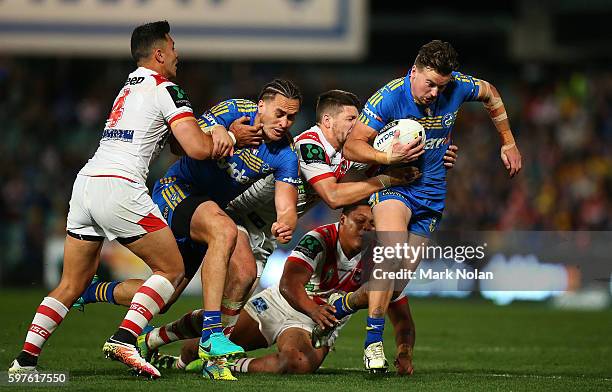 Clinton Gutherson of the Eels makes a line break during the round 25 NRL match between the Parramatta Eels and the St George Illawarra Dragons at...
