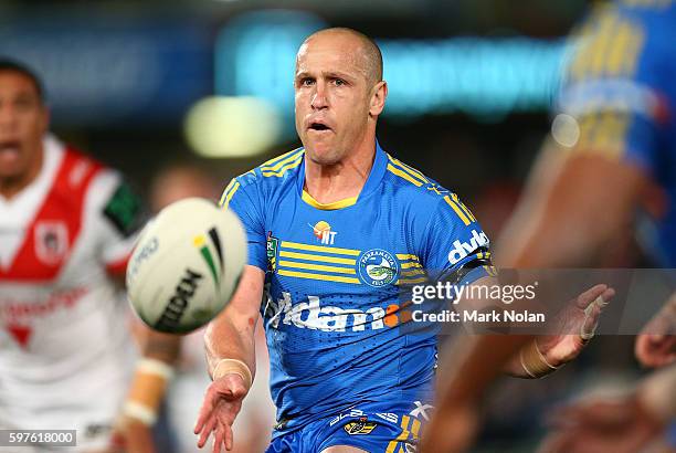 Jeff Robson of the Eels passes during the round 25 NRL match between the Parramatta Eels and the St George Illawarra Dragons at Pirtek Stadium on...