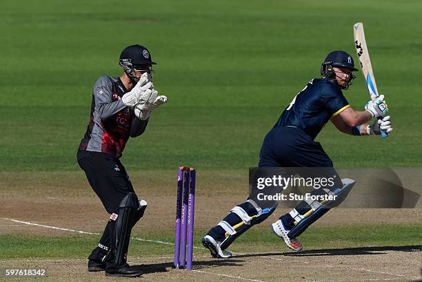 Warwickshire batsman Ian Bell hits out watched by wicketkeeper Ryan Davies during the Royal London One-Day Cup semi final between Warwickshire and...