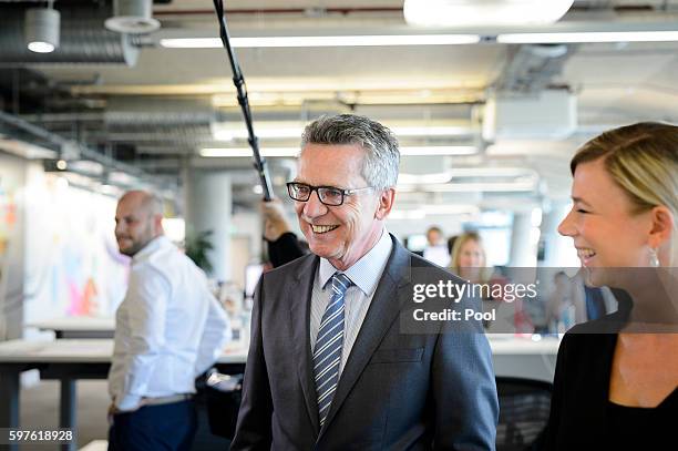 German Interior Minister Thomas de Maiziere tours the Berlin office of Facebook on August 29, 2016 in Berlin, Germany. The German government has put...
